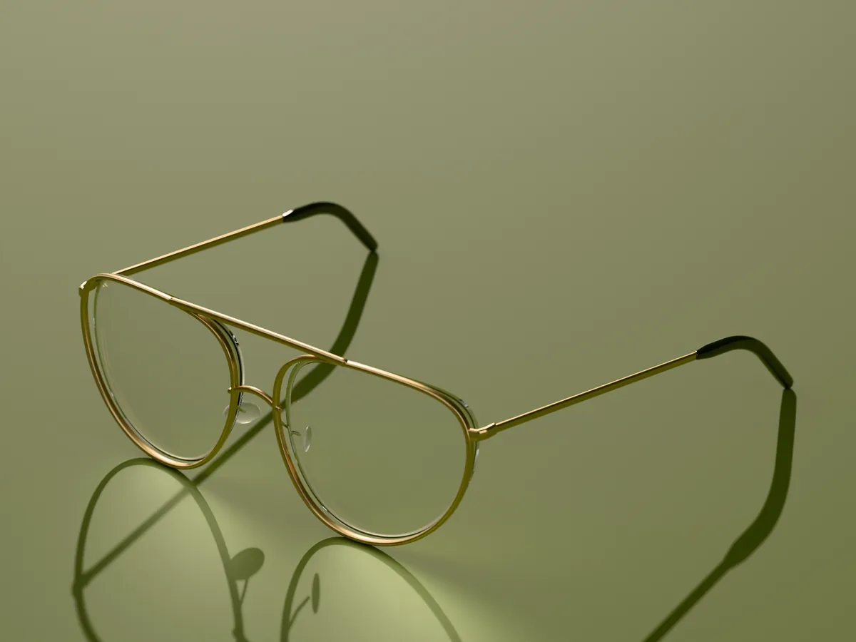 Sable aviator glasses in Brushed gold, in low sun on an olive ground